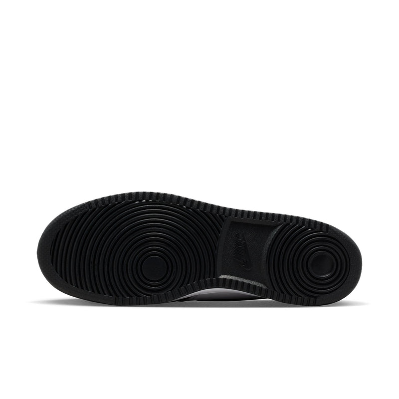 Black rubber outsole for low-top sneakers with circular tread pattern.