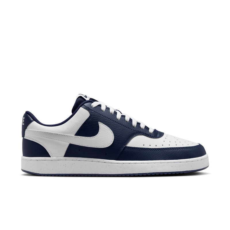 Men's low-top sneakers in navy and white with white Swoosh and lace-up front.