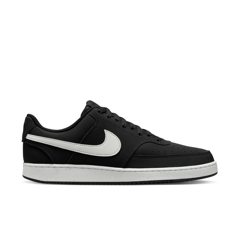 Black low-top sneakers with white swoosh and lace-up front