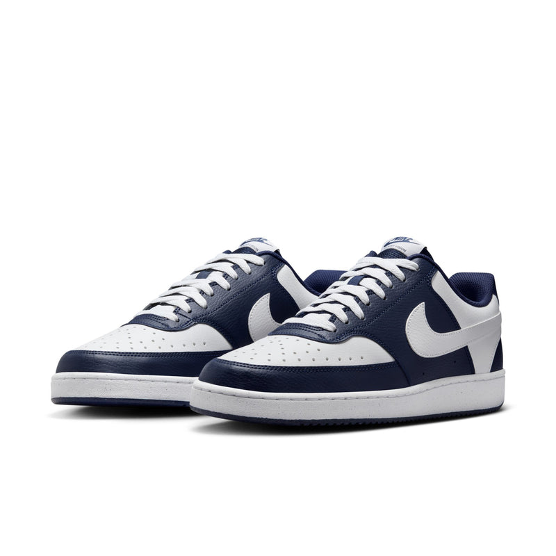 Pair of men's low-top sneakers, navy and white, with Swoosh logos and white laces.