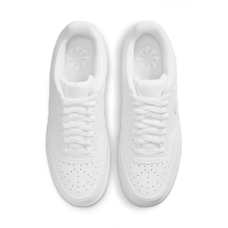 Pair of white low-top sneakers, top view with perforated toe and laces