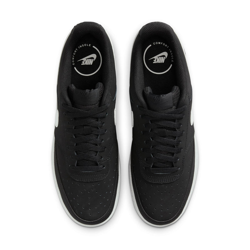 Pair of black low-top sneakers showing front laces and perforated toe
