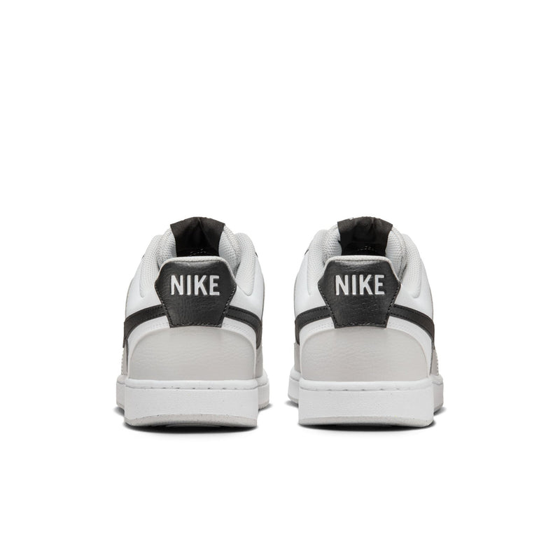 Low-top men's sneakers, back view in white with black heel pull tab and Nike logo.