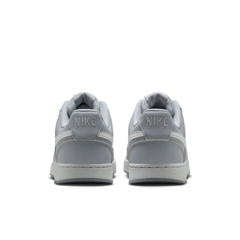 Back view of light gray low-top sneakers with Nike heel tab