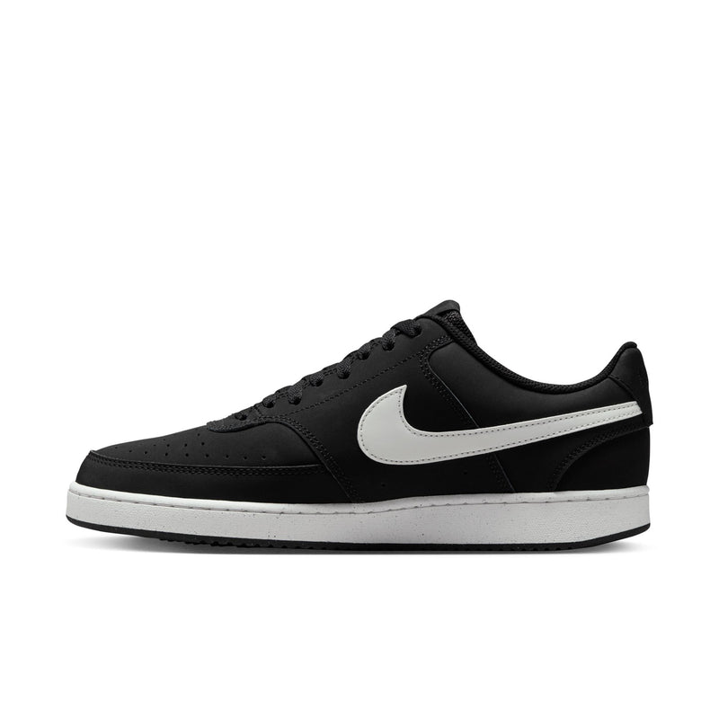 Black low-top sneakers with white swoosh stripe and lace-up eyelets