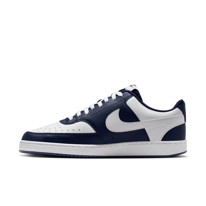 Men's low-top sneakers, navy and white, with Swoosh and white stitched toe.