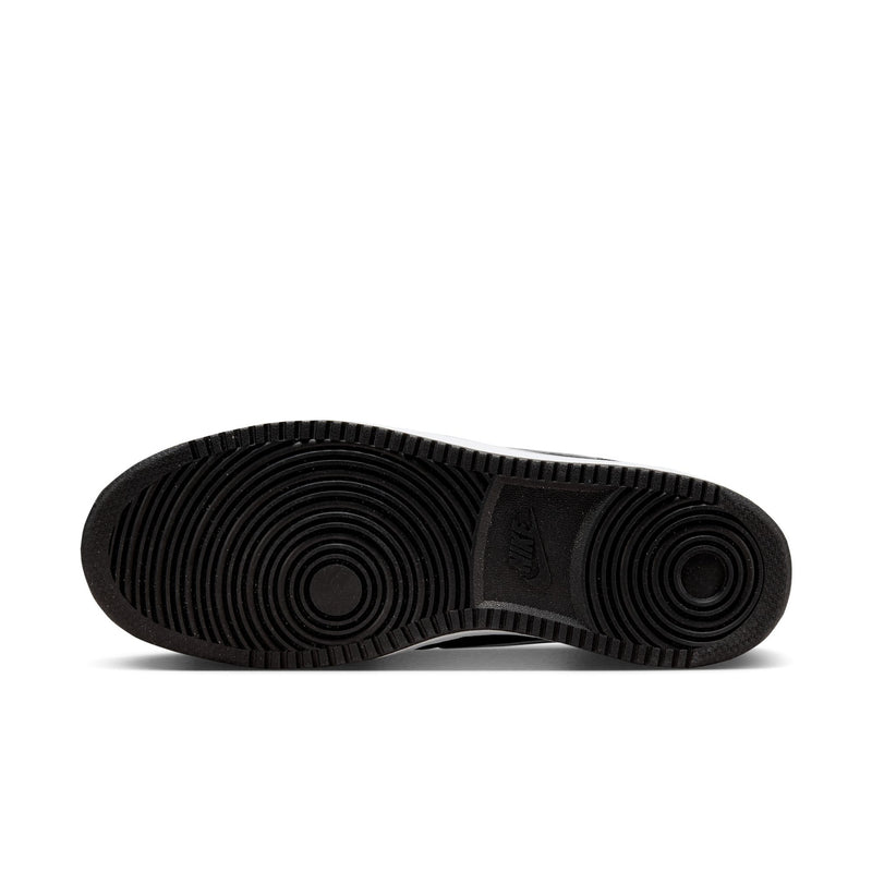 Men's low-top sneaker outsole in black with circular tread pattern.