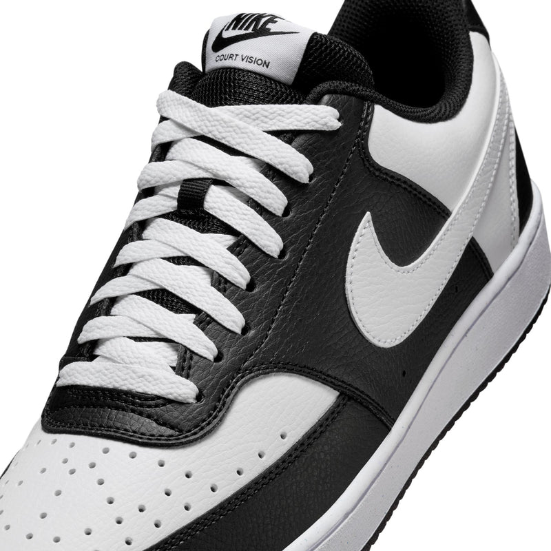 Men's low-top sneakers, black and white, close-up Nike swoosh and laces.