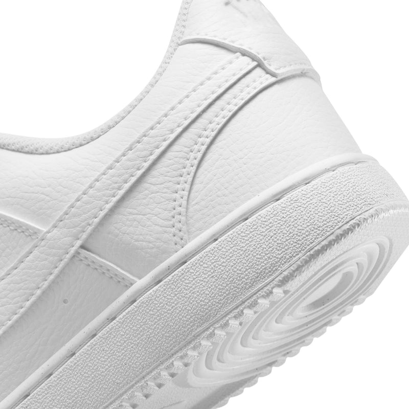 White leather upper detail with stitched panel and Nike swoosh on low-top sneaker