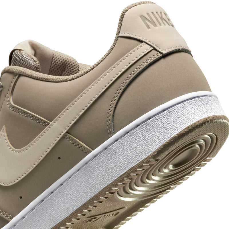 Men's low-top sneaker side, tan upper with Nike logo and textured white outsole
