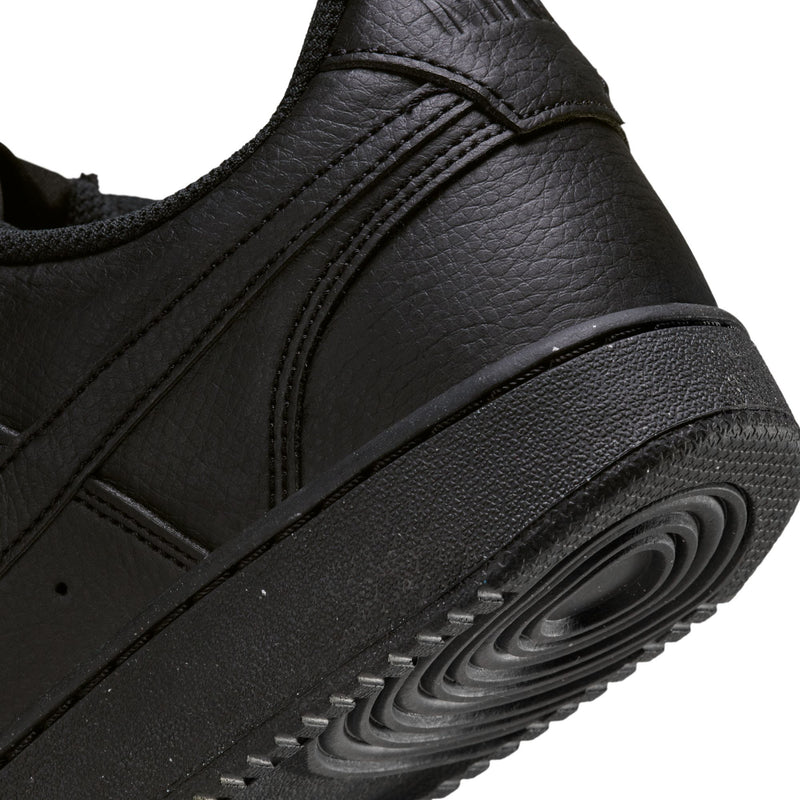 Close-up of black sneaker midsole with textured panel and visible air unit detail