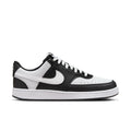 Women's low-top sneakers in black and white, leather-look with swoosh and lace-up design