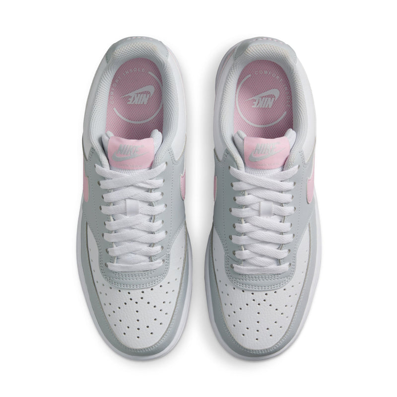 Women’s low-top sneakers, view of insides and laces; light gray with pink lining.