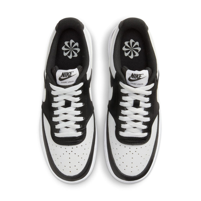 Pair of women's sneakers, top view; black uppers with white laces and perforated toe