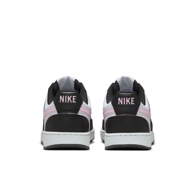 Back view of low-top sneakers with NIKE branding on black heel tabs and white midsoles