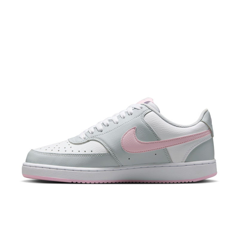 Women’s low-top sneakers, light gray leather upper with pink swoosh and white midsole.