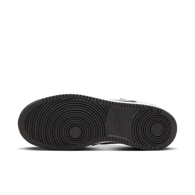 Women's low-top sneaker outsole view; black tread with textured circular pattern