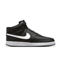 Black mid-top sneakers with white Swoosh and white rubber sole