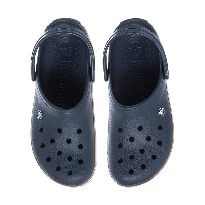Navy rubber clogs, front and back view with vent holes and molded logo detail