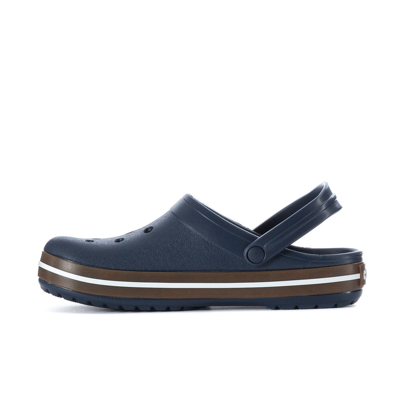 Navy rubber clog with adjustable strap and perforated toe, side profile