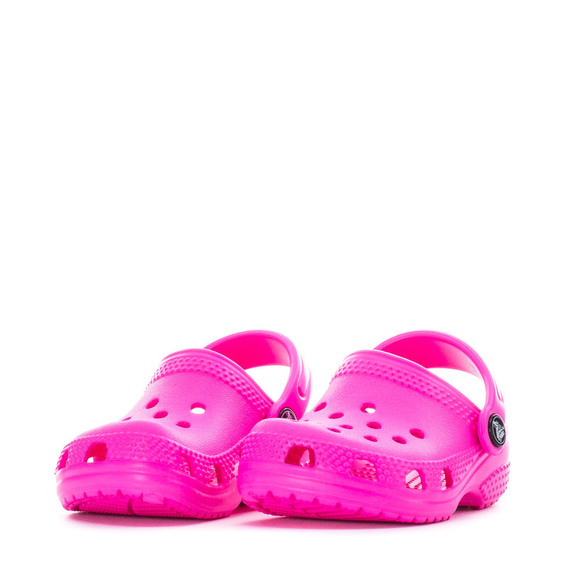 Pair of bright pink infant Crocs clogs with rear heel strap and perforated tops