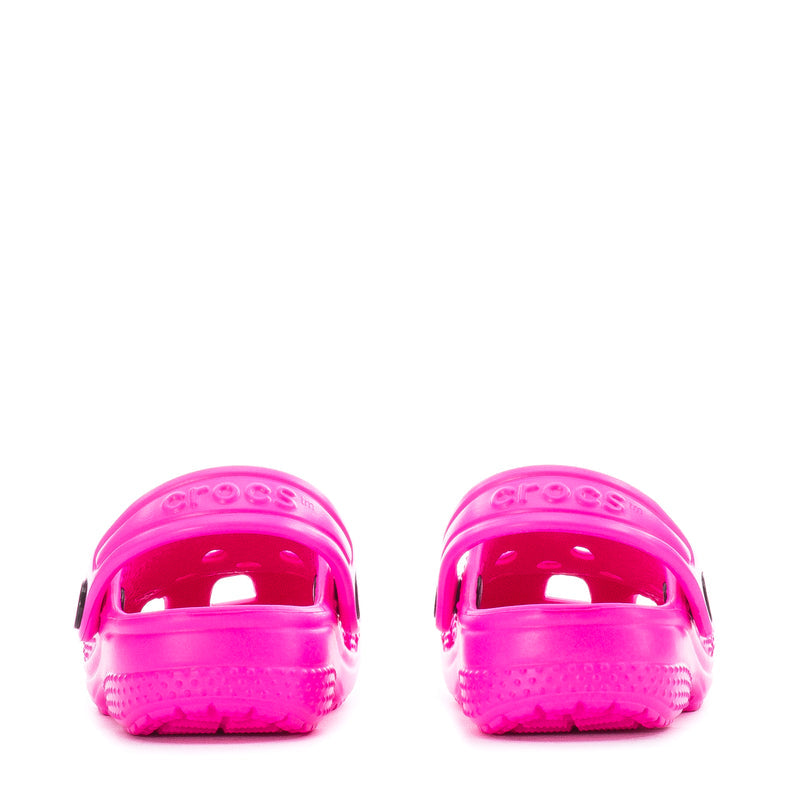 Bright pink infant Crocs clogs shown from the back with strap loops