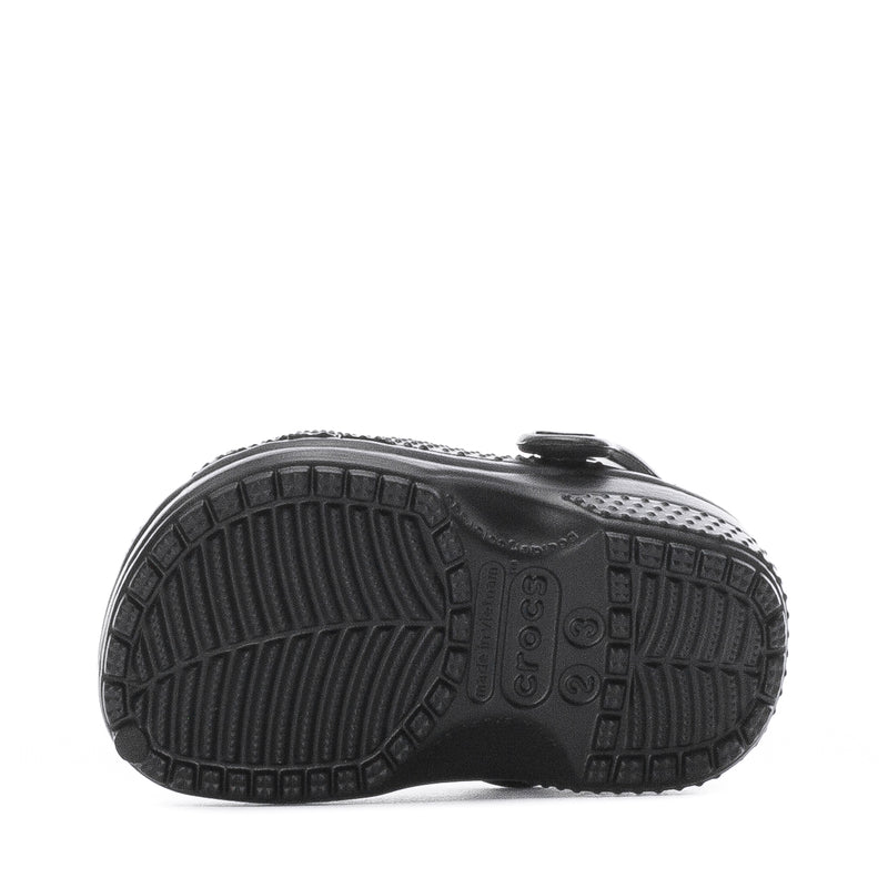 Infant black clog outsole with textured tread pattern