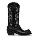 Black cowboy boot with white stitching on a white background