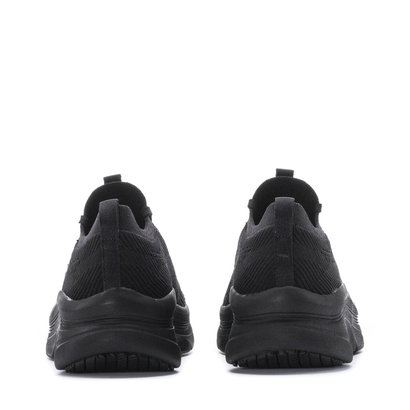 Women's black wide walking sneaker heel view, padded collar and cushioned sole