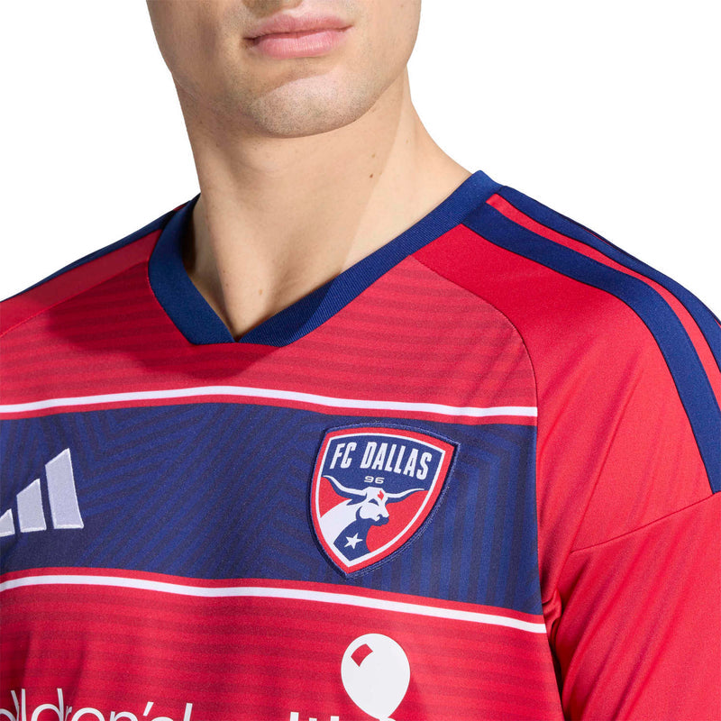 Men's red and navy soccer jersey close-up, V-neck trim and FC Dallas crest logo