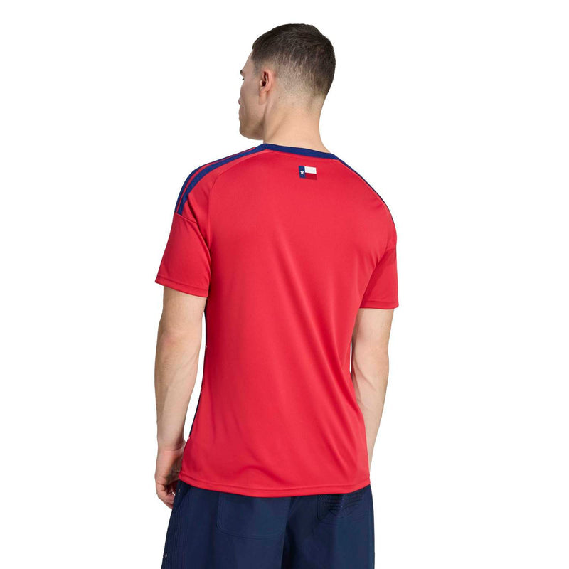 Men's red soccer jersey back with navy shoulder stripes and small upper-center flag logo