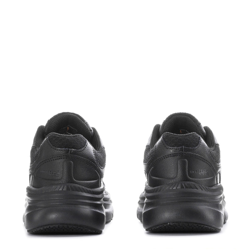 Black slip-resistant women's sneakers, back view with heel tab and ridged sole