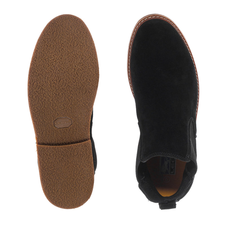 Boot soles view: tan outsole and black upper with elastic side