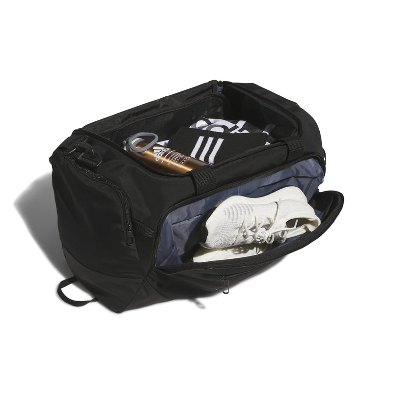 Black small duffel bag open top with interior compartments and sneakers inside
