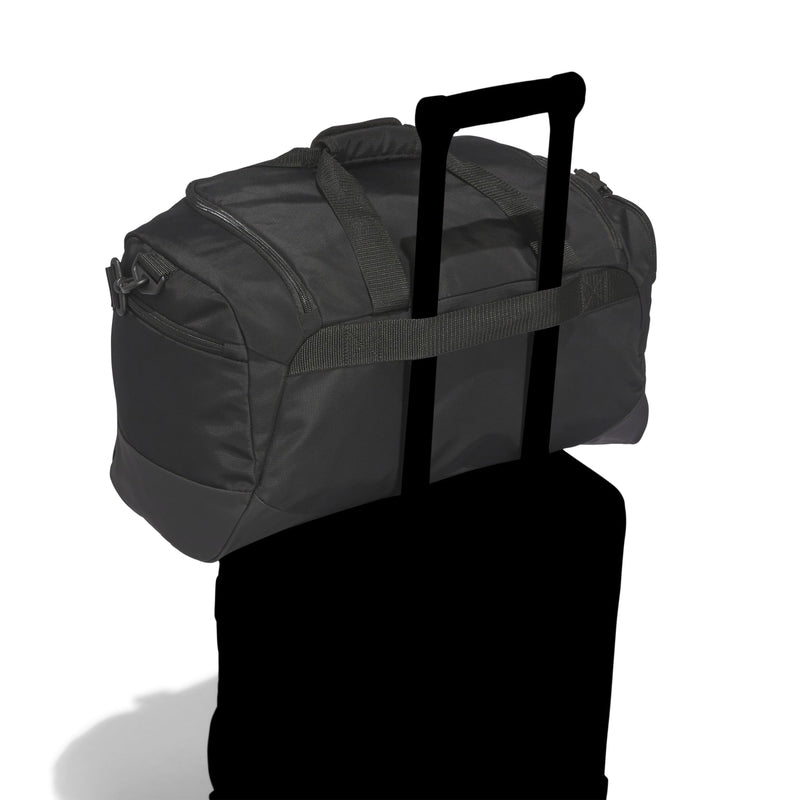 Black small duffel bag with top grab handle and side carry straps