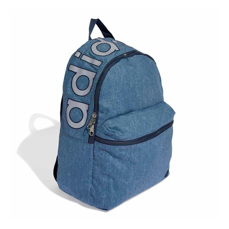Light denim backpack angled view with front zipper, curved top, and large side logo