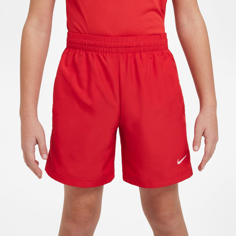 Youth red athletic shorts with elastic waistband and side Nike swoosh logo