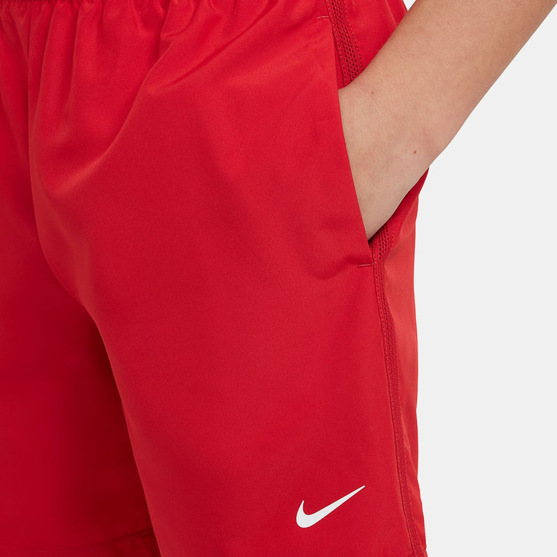 Red youth shorts with side seam and Nike swoosh logo on lower leg