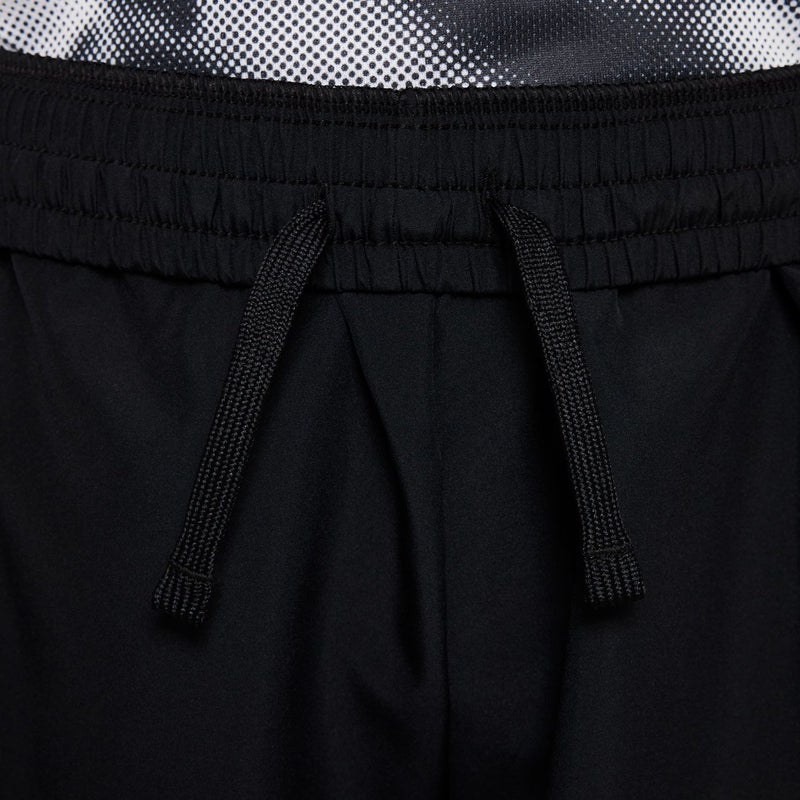 Black youth athletic shorts with drawstring detail and elastic waistband close-up