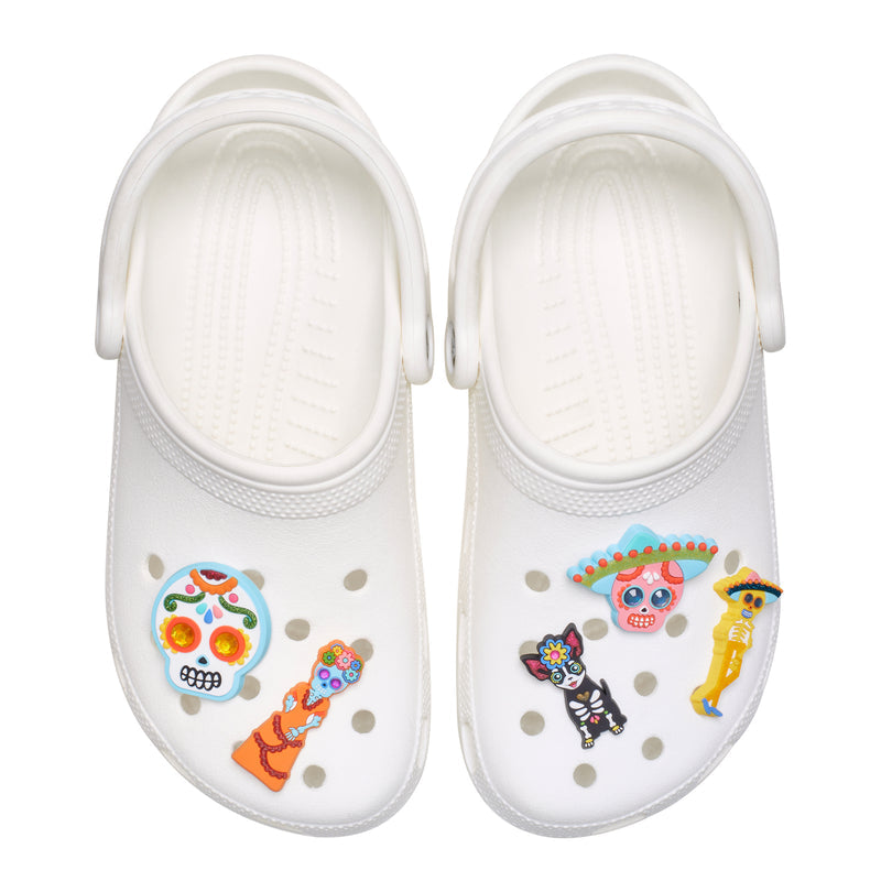 White clog charms set: skull, catrina, and skeleton figures in colorful Dia de Muertos style