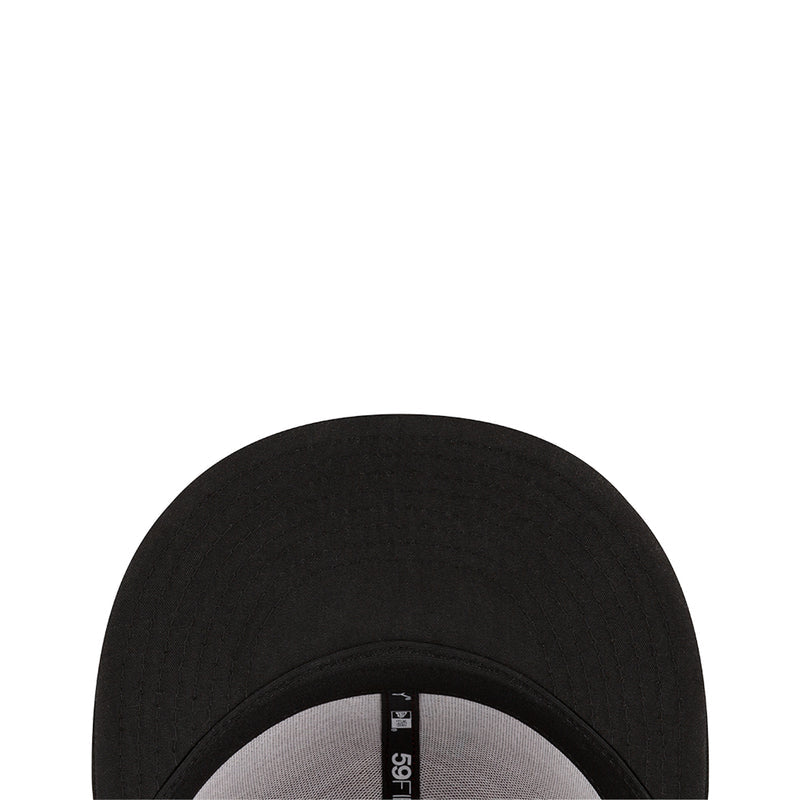 Black baseball cap showing inner brim with white fabric label
