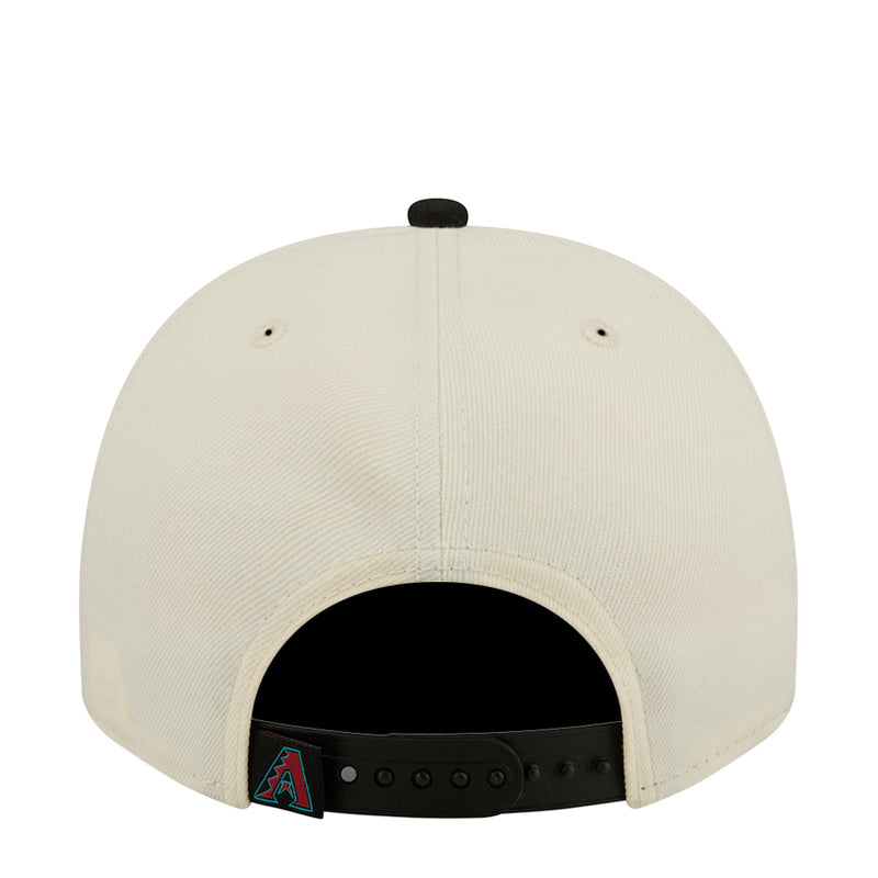 Cream A-frame baseball cap back with ventilation eyelets and black under-strap
