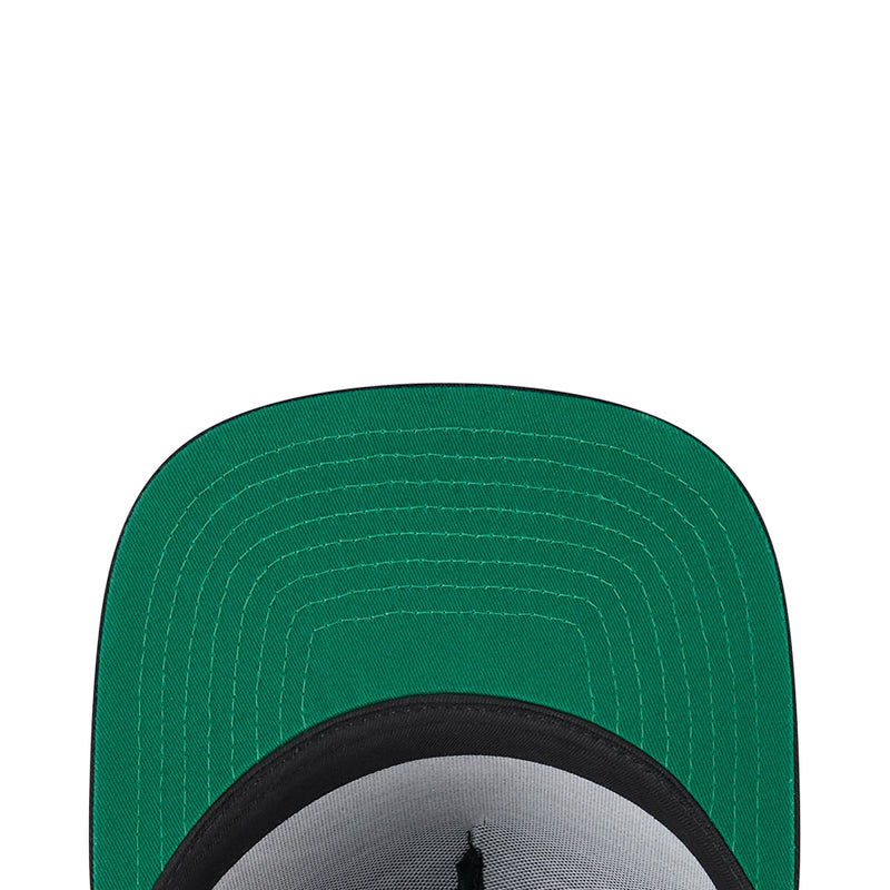 A-frame cap brim underside in green with visible stitching and black inner band