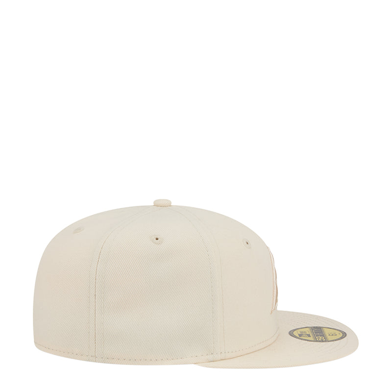Light cream baseball cap with curved brim, side view, small eyelets