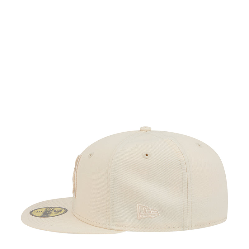 Light cream baseball cap with small side logo patch, front angle