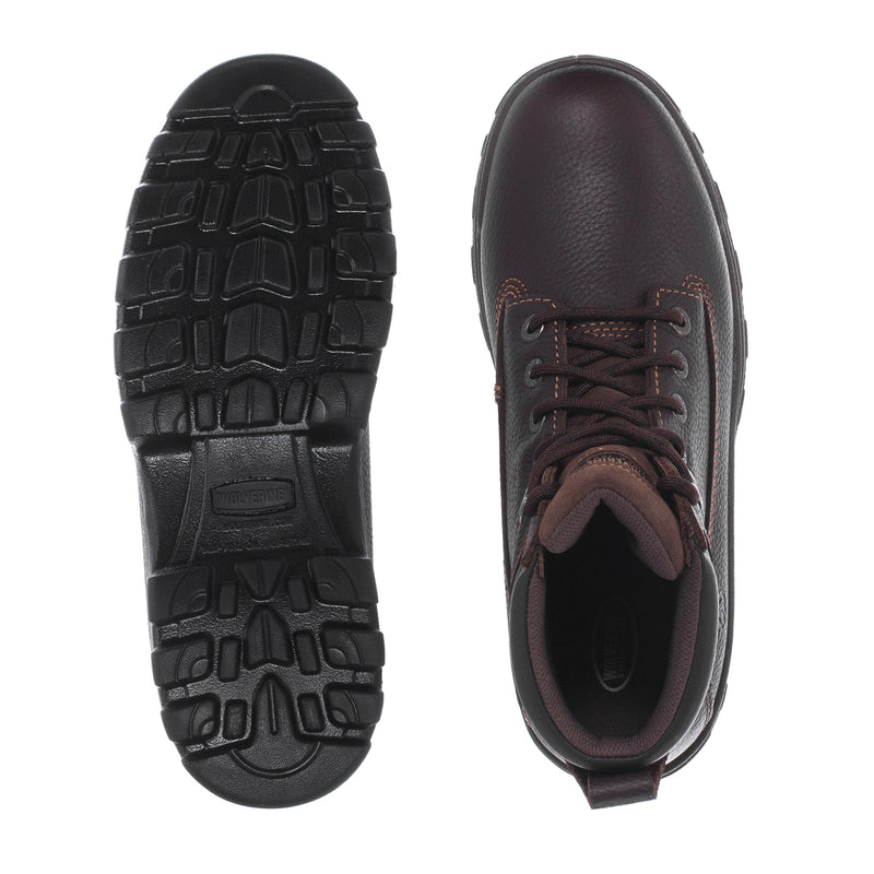 Dark brown boot soles and inner view, showing tread pattern and lace-up opening
