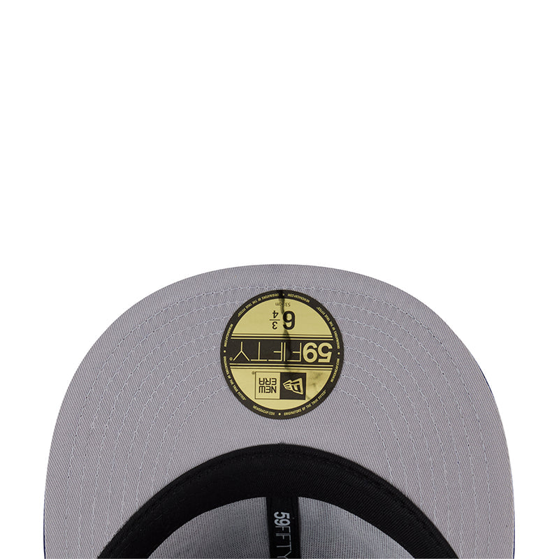 Light gray cap underside with circular size/stitch detail and black inner band