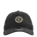 Black baseball cap with circular LA Dodgers gold badge on the front