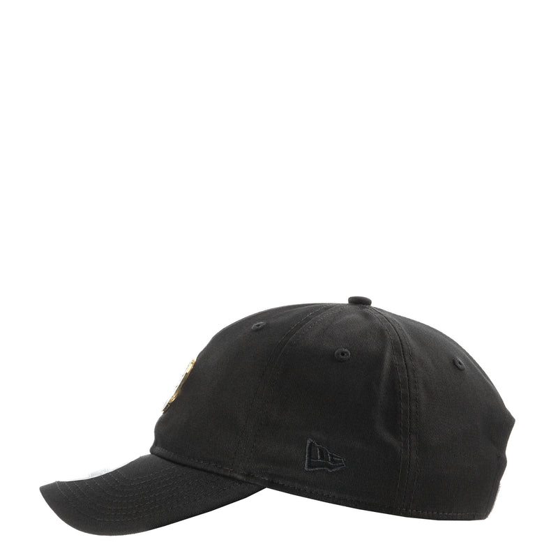 Black baseball cap with small side emblem and curved brim