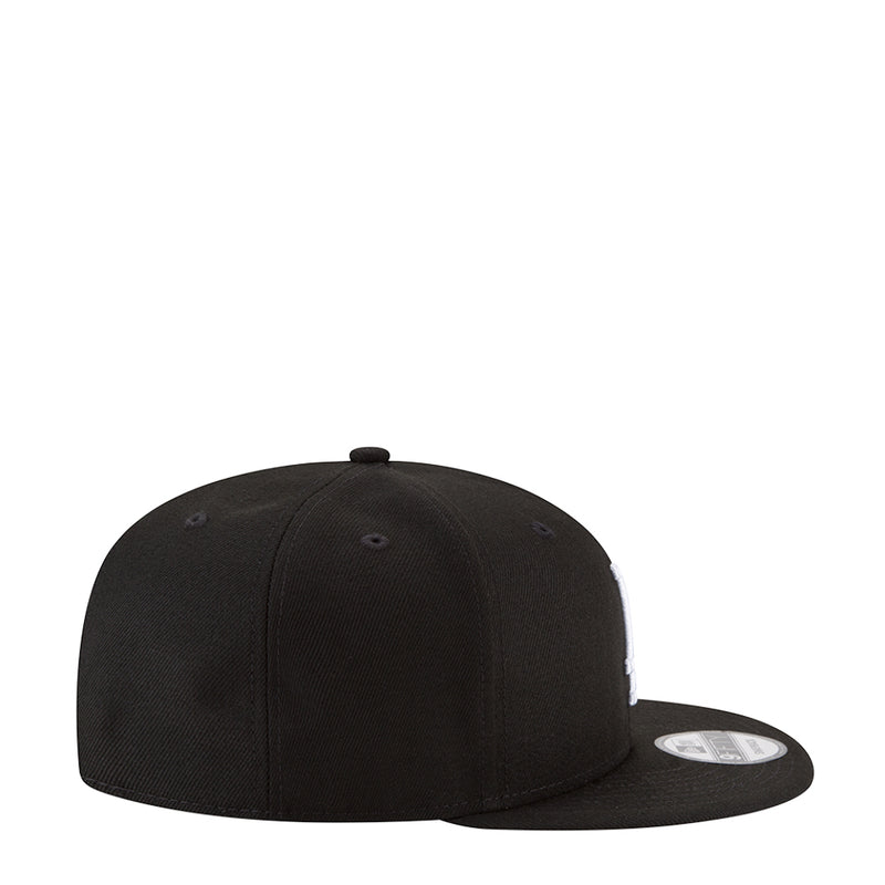 Black baseball cap side profile, curved brim and snapback